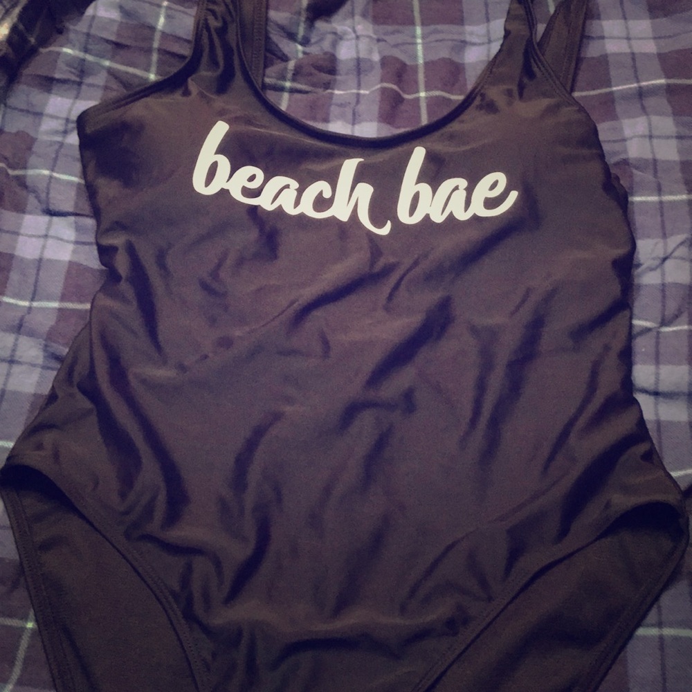 Black one piece suit with logo